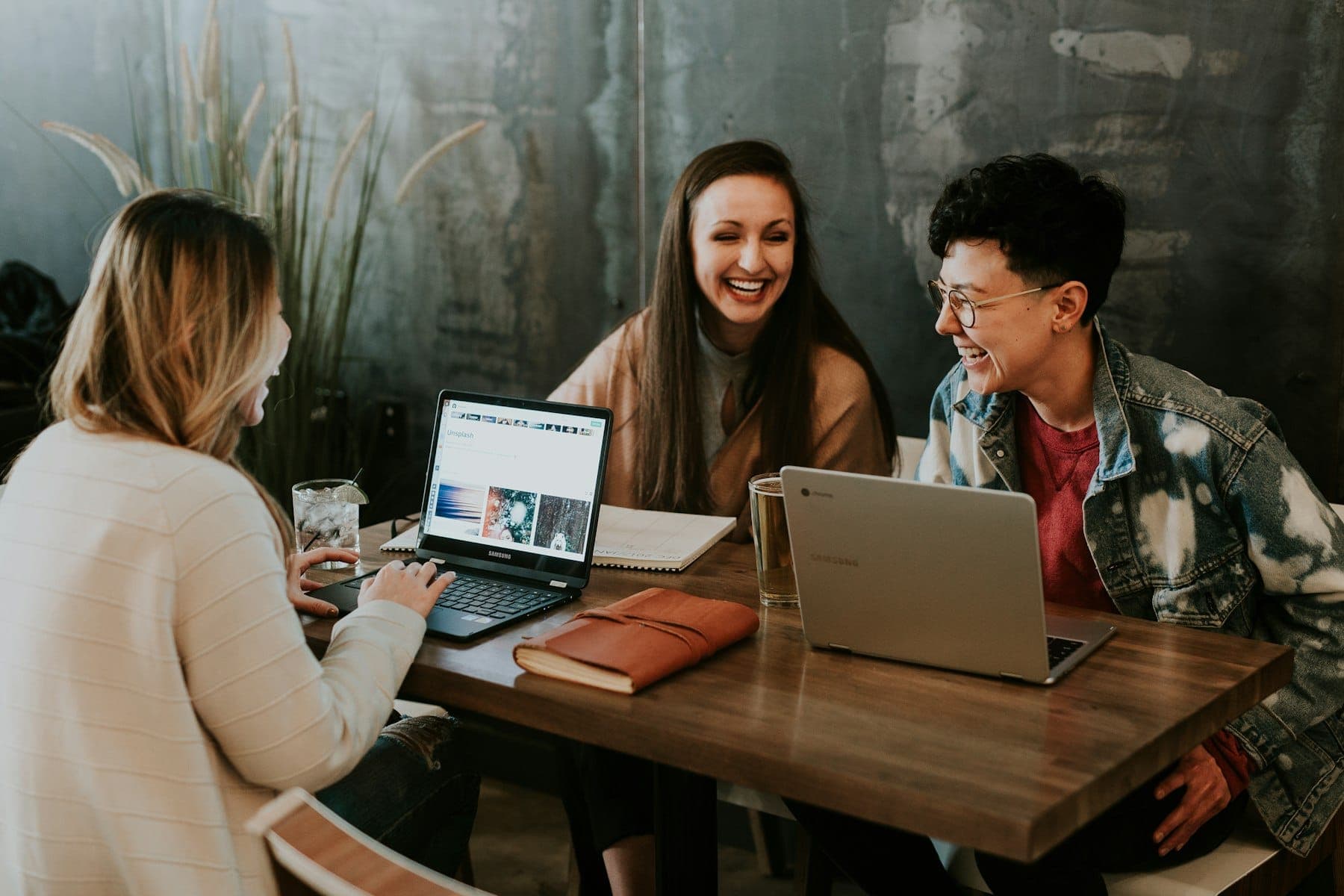 Startup founders planning a product together around laptops