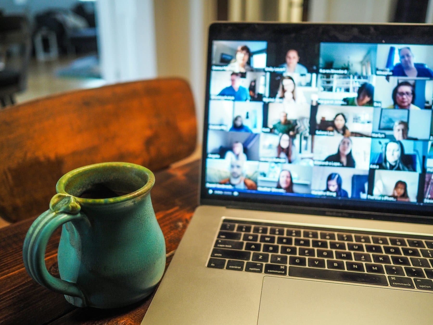 A video call with a remote team on a laptop screen