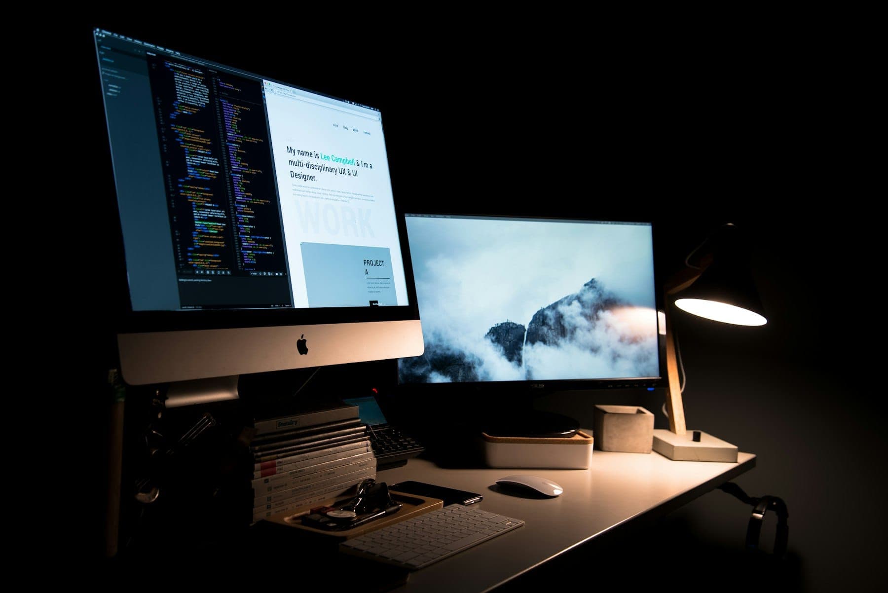 A website design open on a desktop monitor in a dark studio